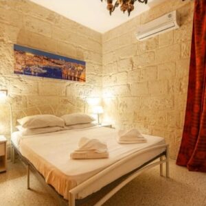 Bedroom of a Centrally Located Sliema Townhouse - Rent Townhouse in Sliema